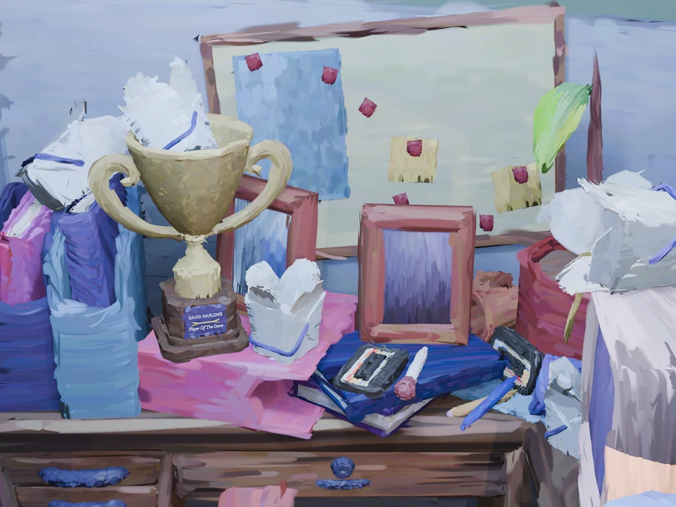 David's desk, cluttered with binders, takeout boxes and a Player of the Game trophy