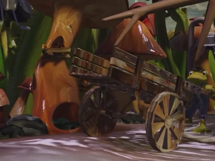 GoomVille in 3D: a frog beside a wooden wagon with oil-painted textures